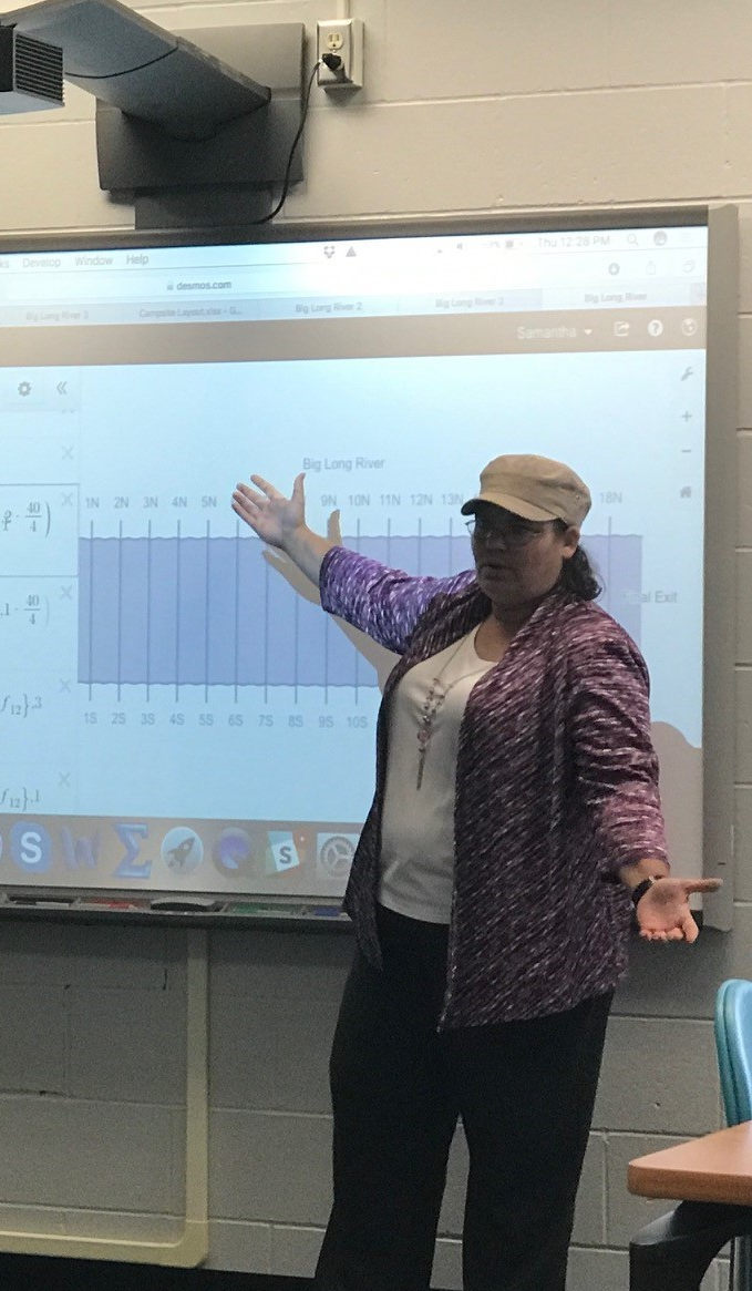 Math teacher lesson at smartboard