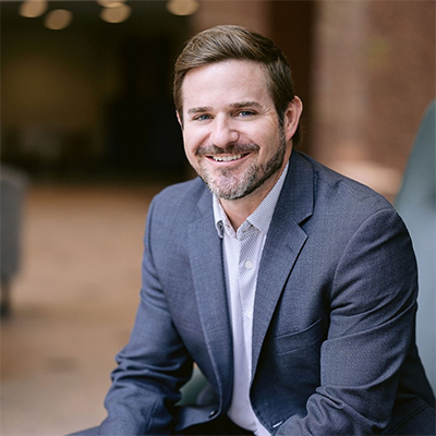 headshot of Ryan Antkowiak, man dressed in suit sitting