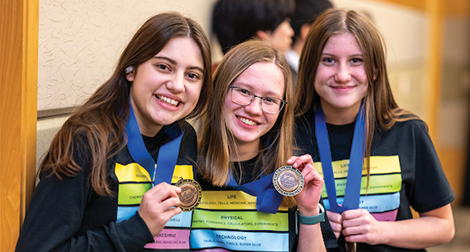 Science Olympiad participants show off their placement medals