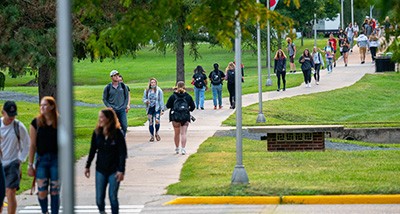 Students walk through campus on the first day of the semester
