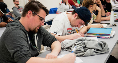 Two students taking a math test