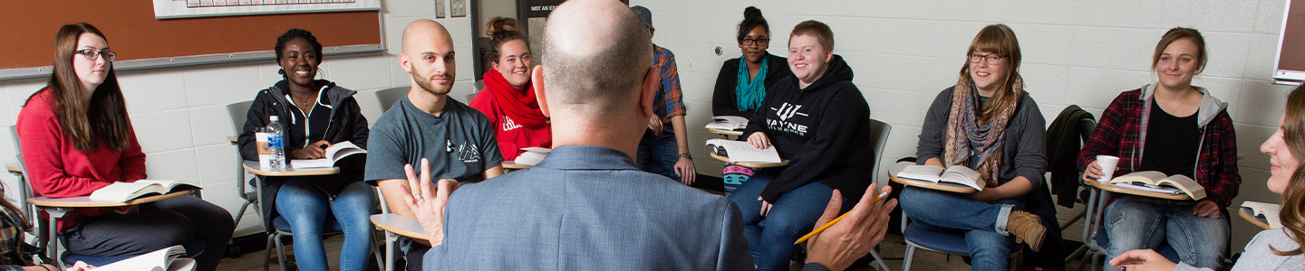 Group of School Psychology Graduate students hold a discussion in class 