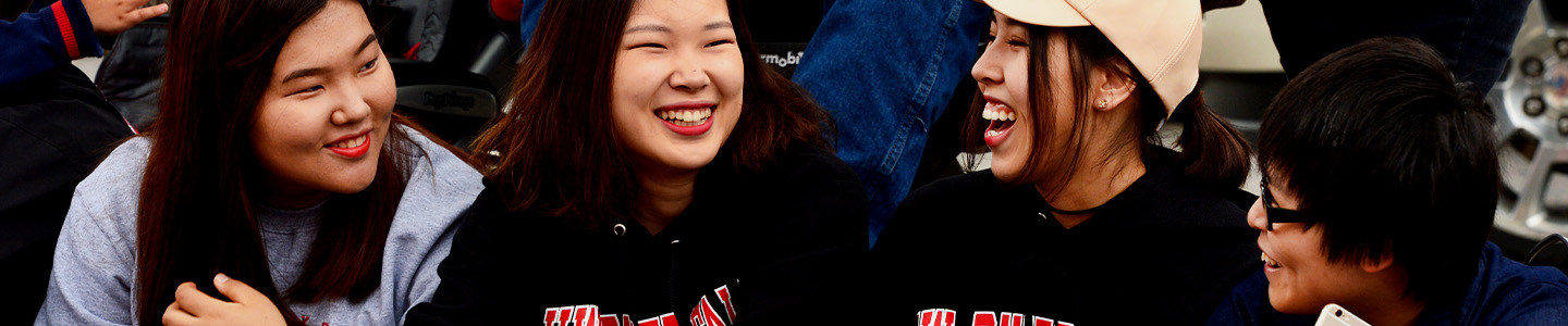 Four International Students attend the UWRF Homecoming parade 