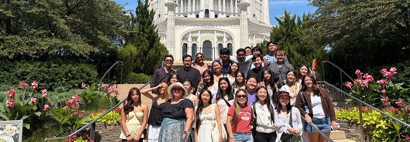 upward bound students stand together on the steps in front of a capital building