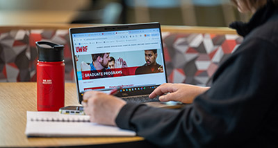 a computer screen shows a webpage that says "graduate programs"