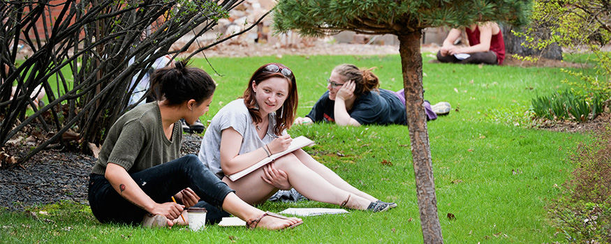 Students enjoying the weather and studying outdoors