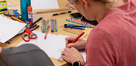 Montessori Student practices geometry in the classroom