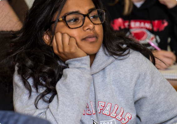 A student listening to an instructor