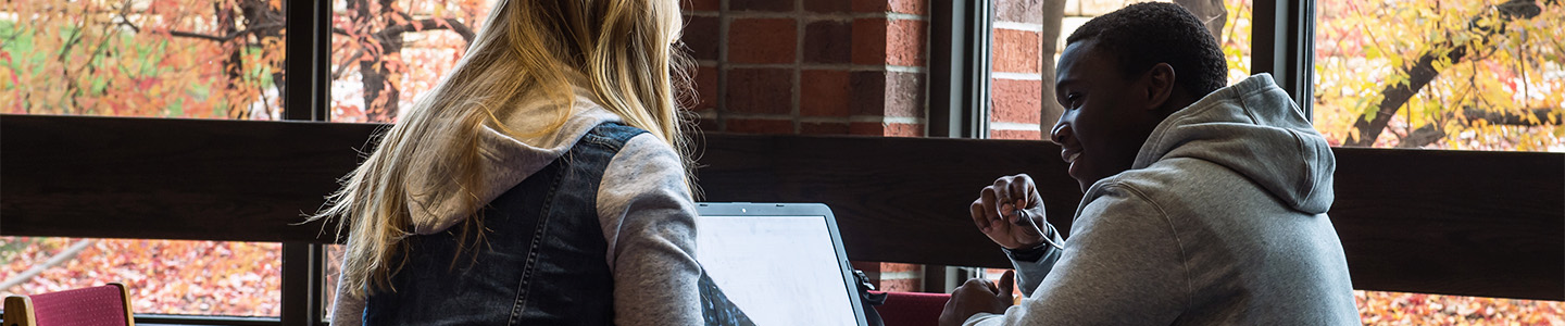 Two students studying at a table