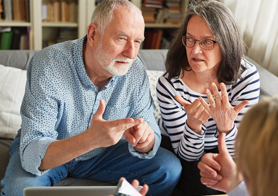 Man and woman discussing retirement planning