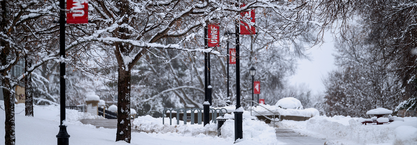 Snow covers the campus in front of the University Center