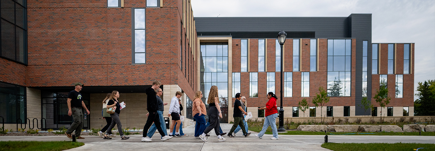 An admissions tour group walks past the newly opened Science and Technology Innovation Center