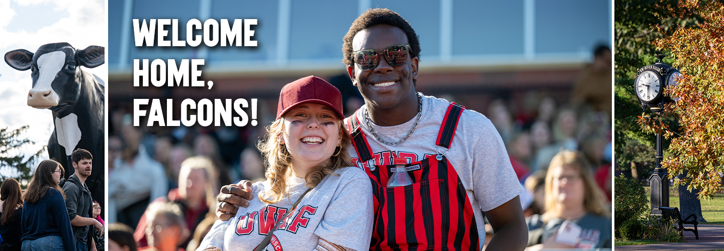 A white female student and black male student smile at the camera during the homecoming football game. 